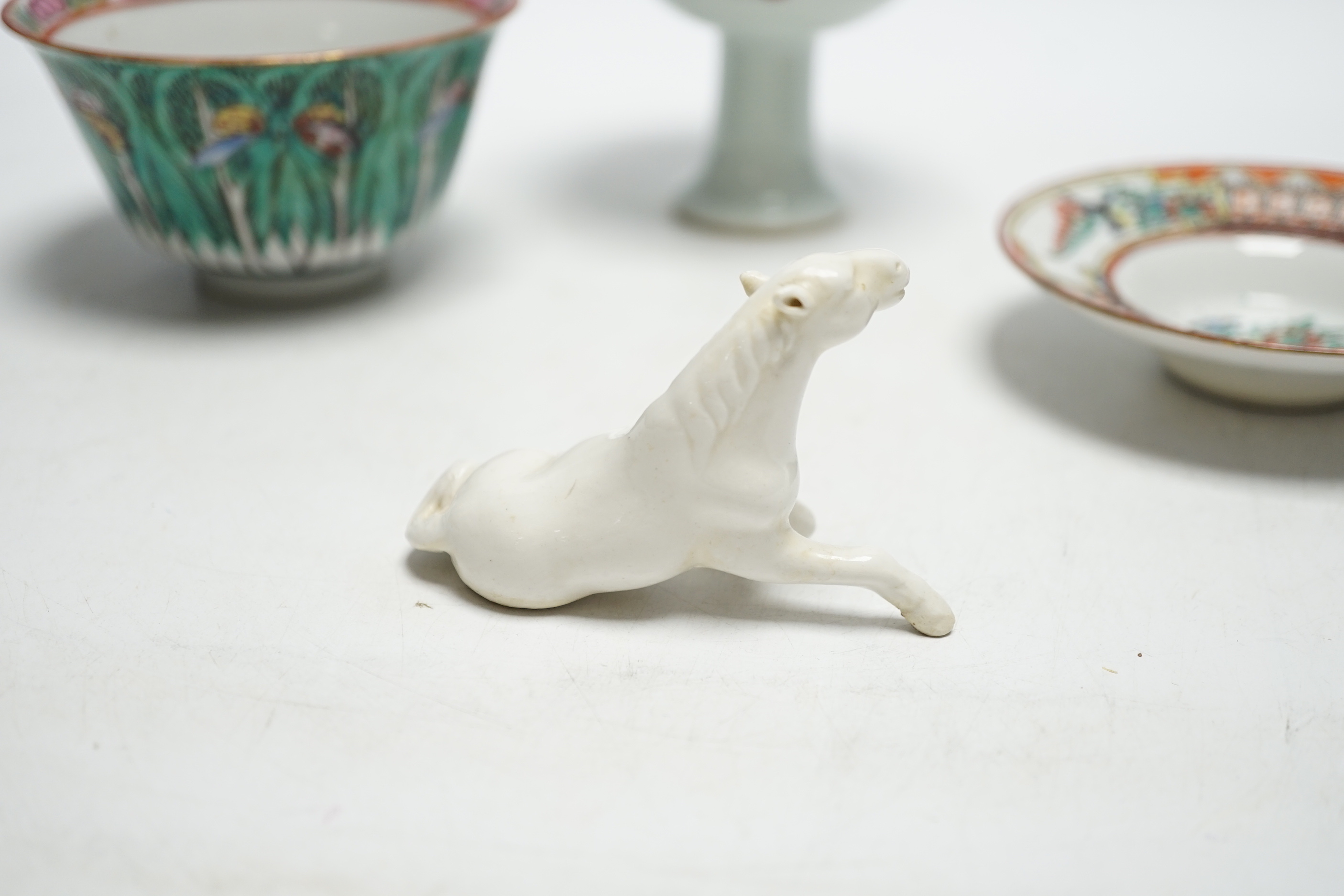 A Chinese tea bowl and stand, a white glazed horse and a pedestal bowl, tallest 9cm high